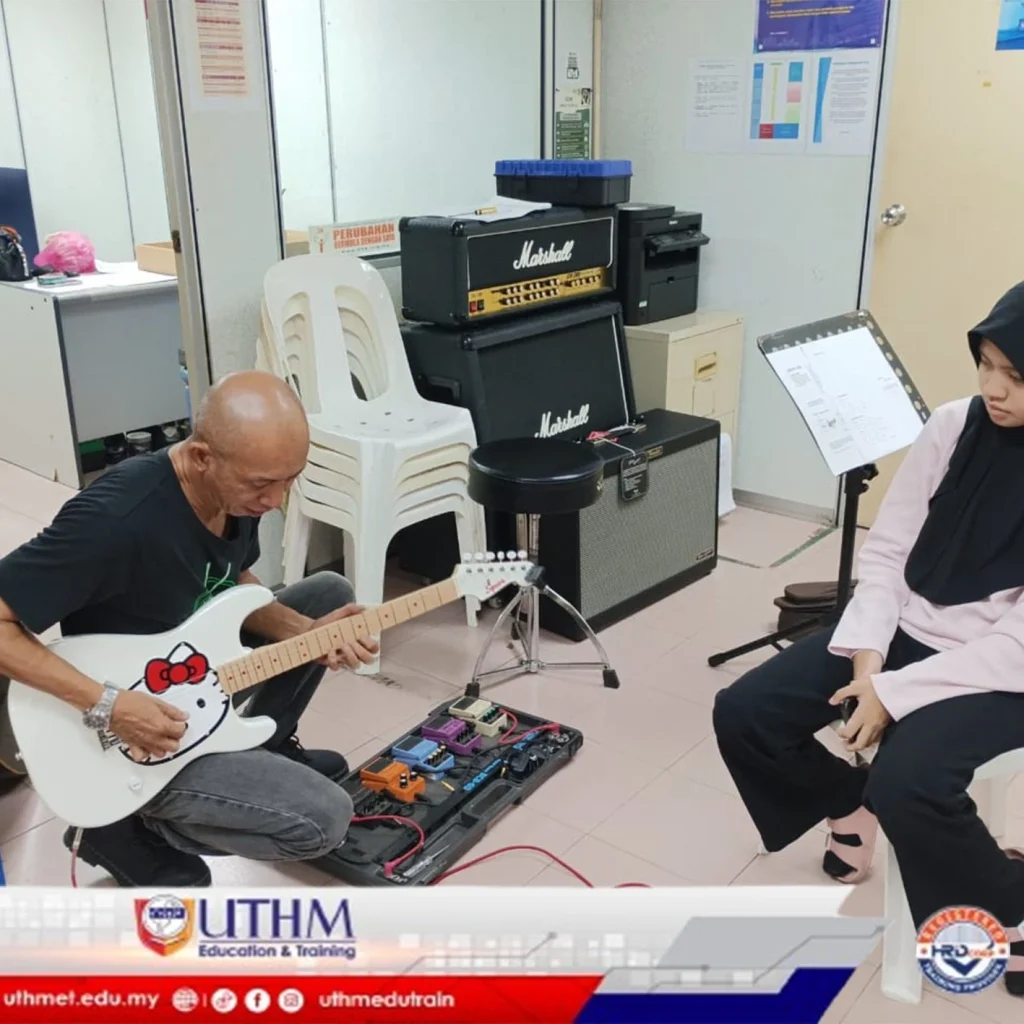 guitar training session with instructor at UTHM